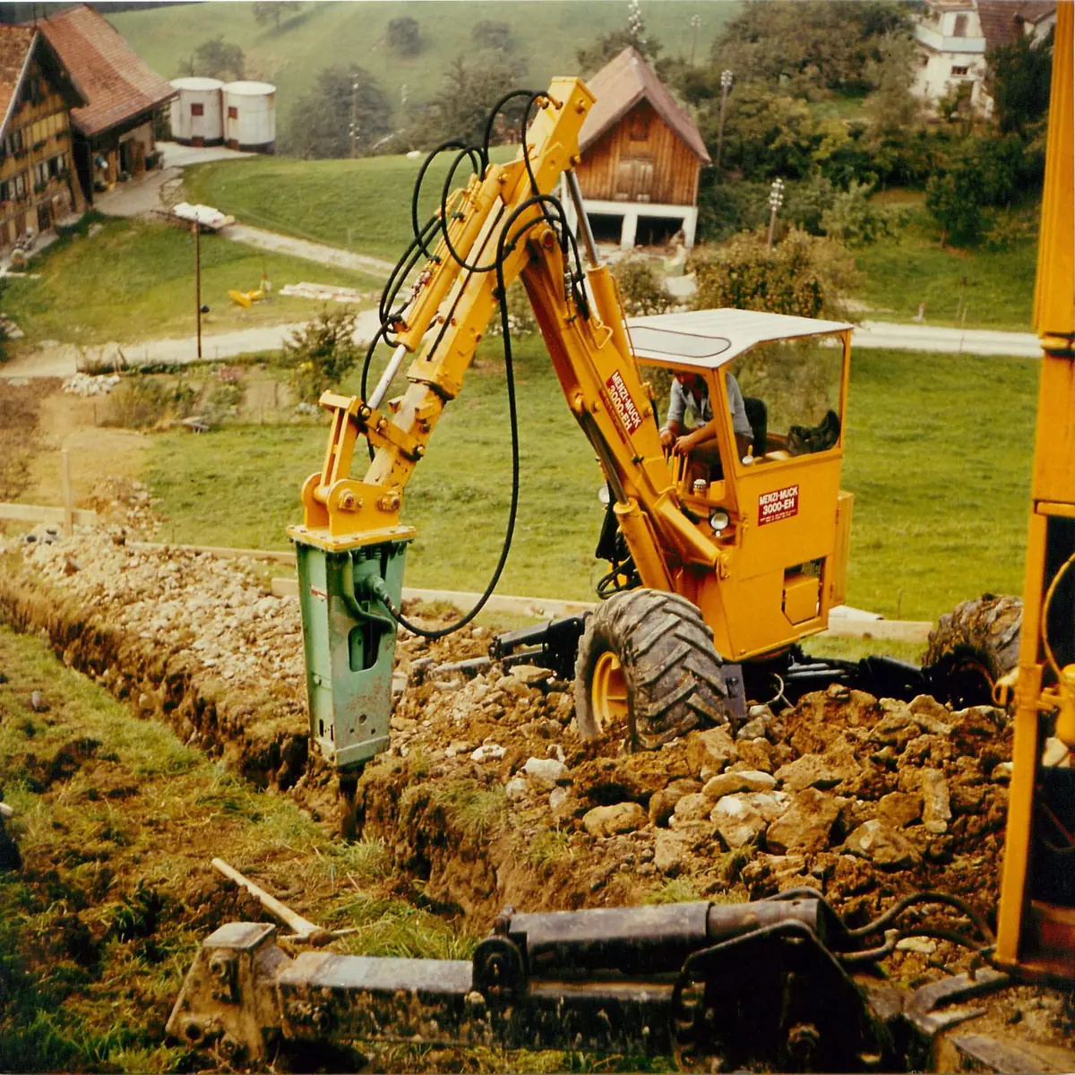 Menzi Muck din primele decenii, în lucru